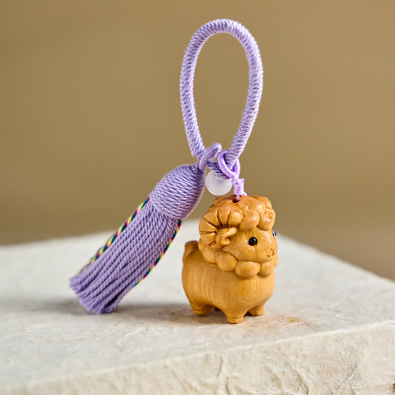 Buddha Stones Portachiavi con la capra dello zodiaco cinese, intagliati a mano in legno di eucalipto e sandalo arcobaleno, anno della capra. - image 1