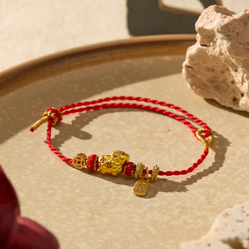 Buddha Stones Braccialetto intrecciato con ciondolo a forma di capra e cordino rosso, simbolo della fede. - image 1
