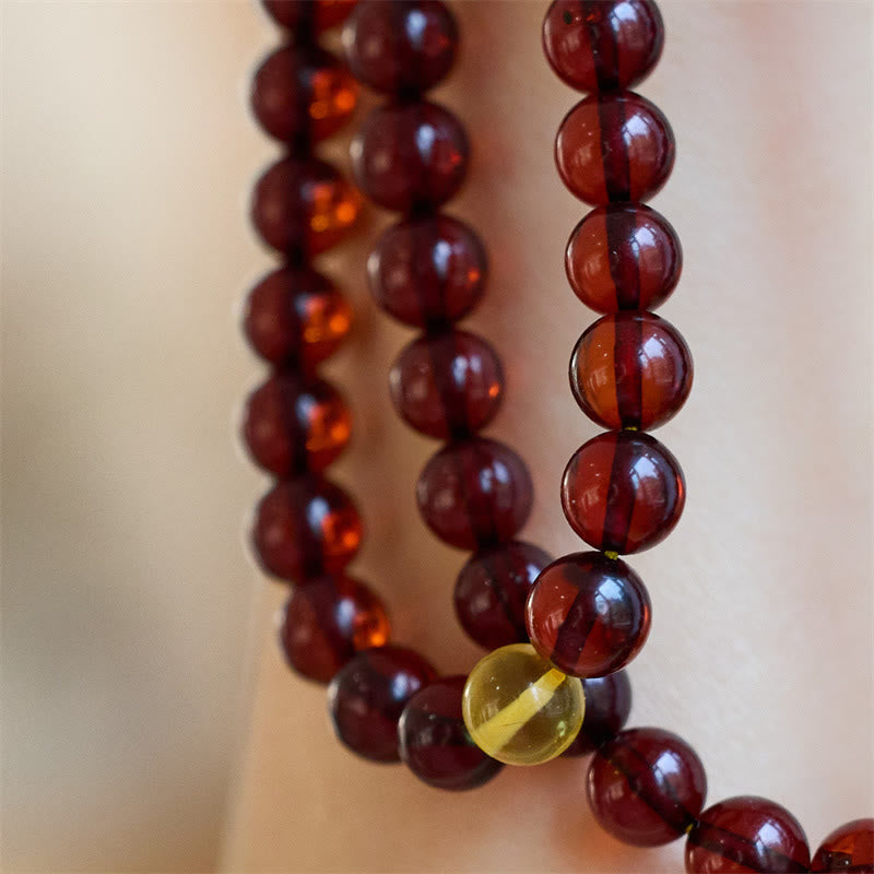 Braccialetto anti-ansia in ambra trasparente con 108 perle di Mala naturali Buddha Stones