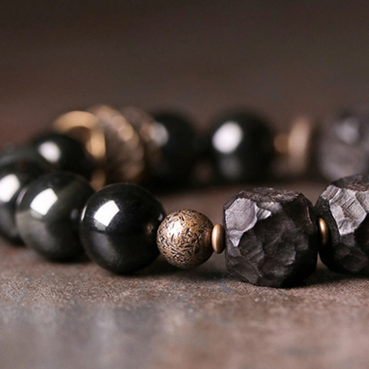 Braccialetto di coppia forza in rame, legno di ebano e ossidiana nera Buddha Stones
