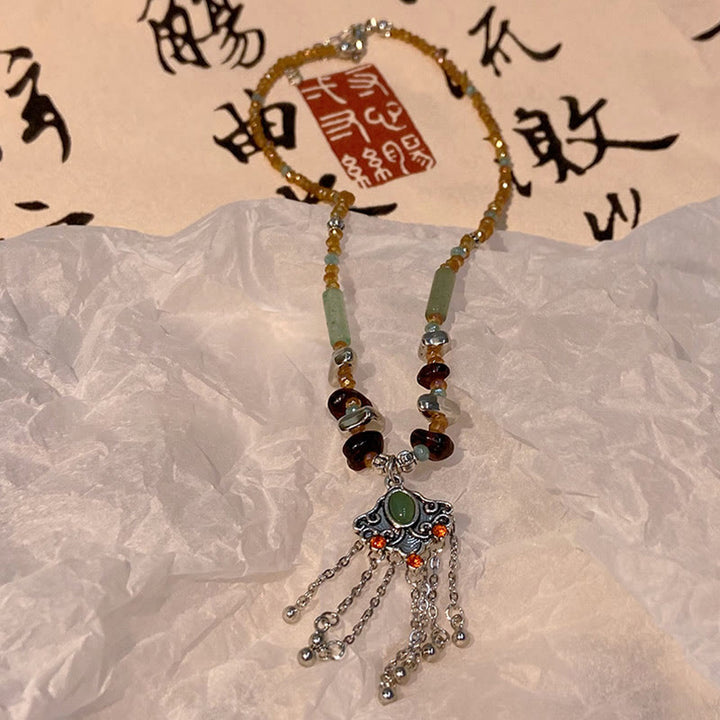 Buddha Stones Pietra di cristallo tibetana Collana pendente con nappa portafortuna in rame