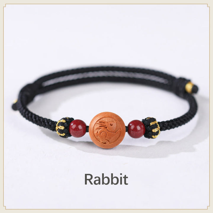 Braccialetto della ricchezza in cinabro intagliato con carattere dello zodiaco cinese Fu in legno di pesca naturale Buddha Stones