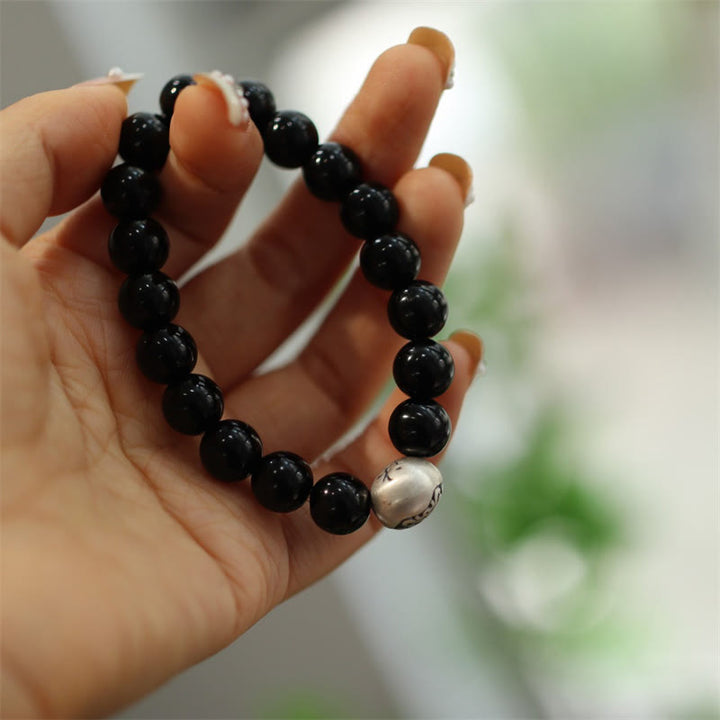 Braccialetto di protezione con perline di onice nero in argento sterling 925 Buddha Stones con incisione del personaggio
