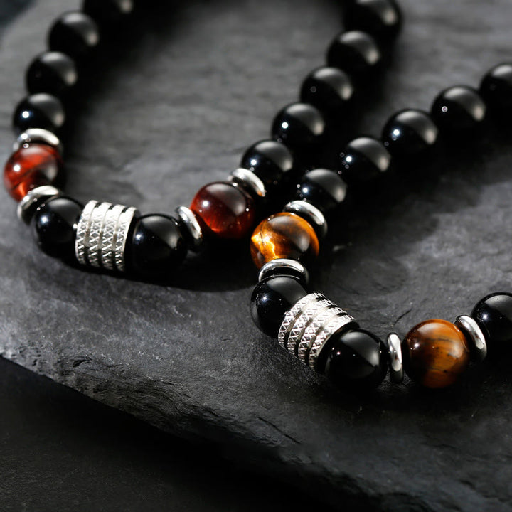 Bracciale Buddha Stones in ossidiana nera naturale con occhio di tigre e forza