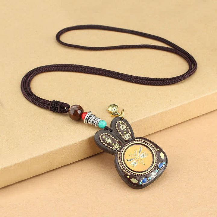 Collana pendente Thangka con cinque divinità della ricchezza in ebano tibetano
