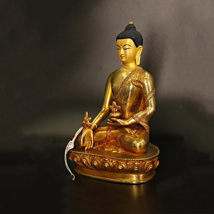 Statua di Buddha Shakyamuni Buddha della medicina Compassione in rame placcato oro Decorazione