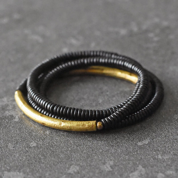 Bracciale multistrato in legno di ebano e rame Buddha Stones Balance