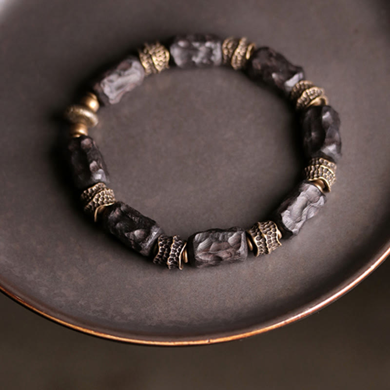 Braccialetto Buddha Stones Tibetano Ebano Legno Rame Calma Pace