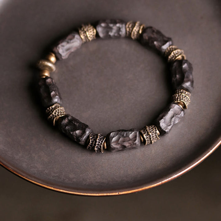 Braccialetto Buddha Stones Tibetano Ebano Legno Rame Calma Pace