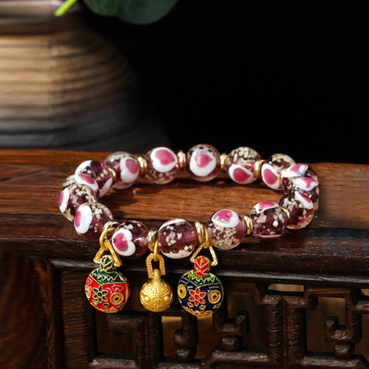 Braccialetto di perline di vetro fluorescente luminoso Liuli con cuore rosa della famiglia di bestie che ingoiano Buddha Stones