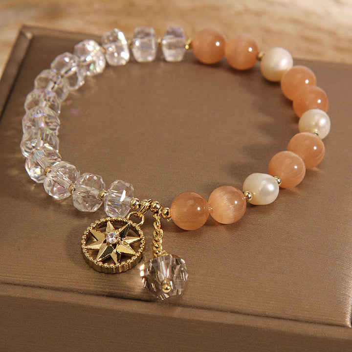 Braccialetto di supporto con stella di cristallo bianco e occhio di gatto arancione Buddha Stones