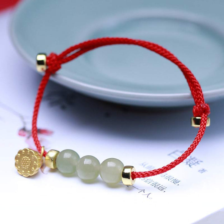Braccialetto intrecciato con corda rossa in semi di loto di giada naturale Buddha Stones