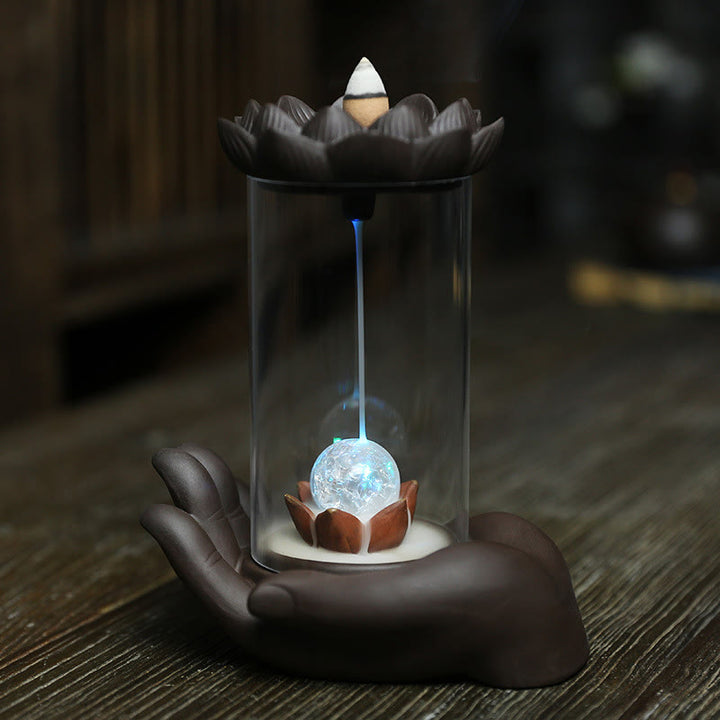 Buddha Stones Mano di Buddha Loto Illuminazione LED Luce Viola Argilla Ceramica Bruciatore di Incenso Decorazione