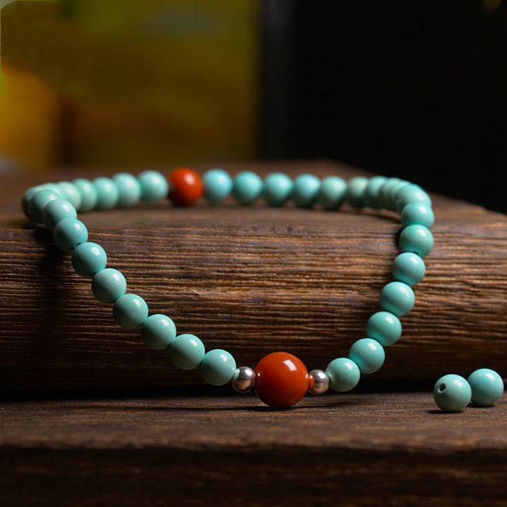 Braccialetto di protezione con perline di agata rossa e turchese Buddha Stones - image 3