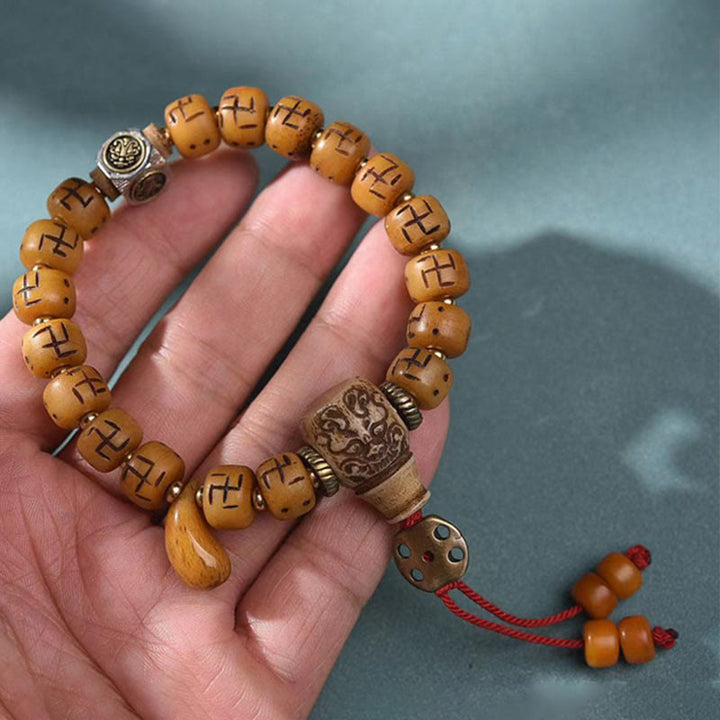 Buddha Stones naturale tibetano osso di cammello svastica Dzi perlina Shankha Buddha fascino Kirtimukha braccialetto con nappa protezione fortuna