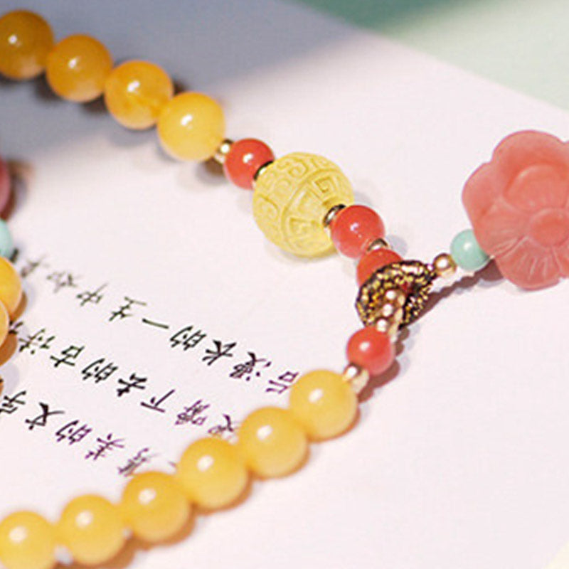 Collana con ciondolo a forma di fiore in ambra curativa e bilanciata