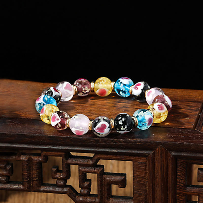 Braccialetto di perline di vetro fluorescente luminoso Liuli con cuore rosa della famiglia di bestie che ingoiano Buddha Stones