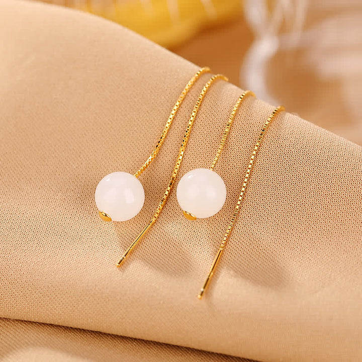 Orecchini pendenti in argento sterling 925 con perline di giada bianca e simbolo della felicità