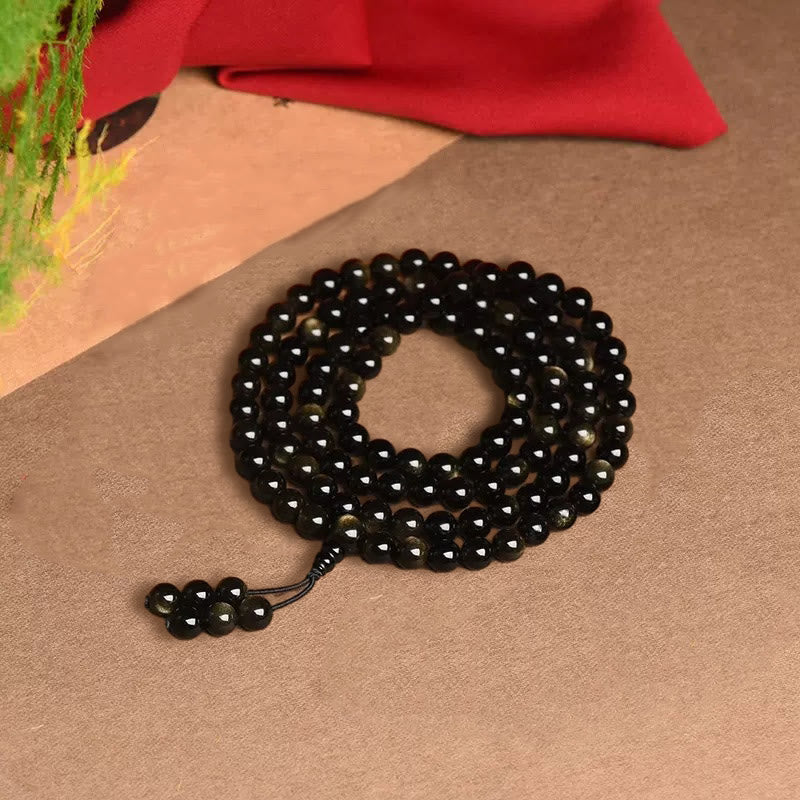 Braccialetto della ricchezza in ossidiana naturale con 108 perle di Mala Buddha Stones