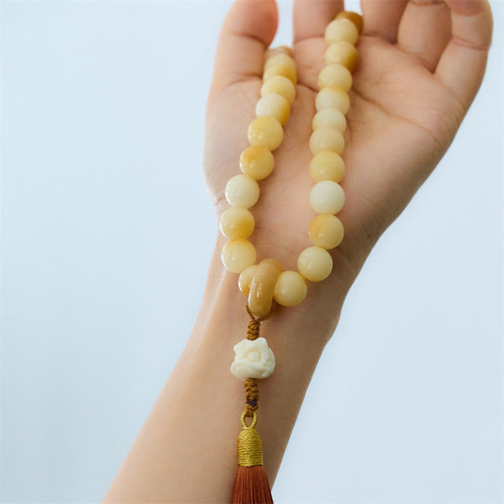 Buddha Stones Semi di Bodhi naturali Avorio Frutta Leone danzante Ciondolo Armonia Nappa Polso Mala
