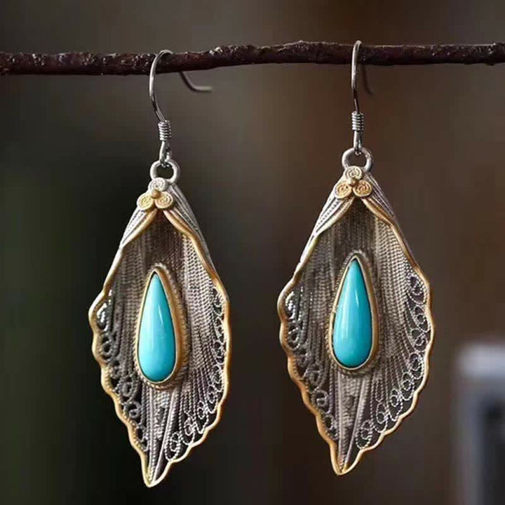 Orecchini pendenti con motivo a foglia di Bodhi in argento sterling 925 con Buddha Stones e turchese