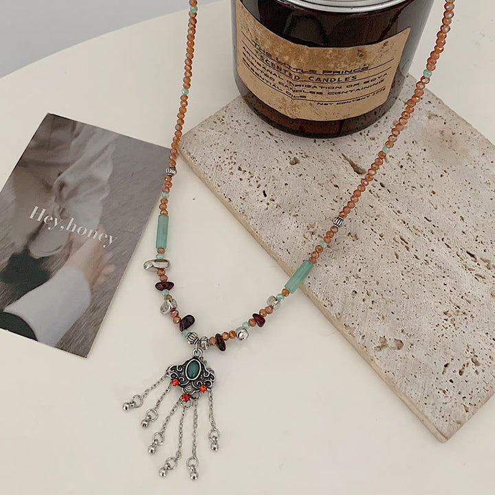 Buddha Stones Pietra di cristallo tibetana Collana pendente con nappa portafortuna in rame