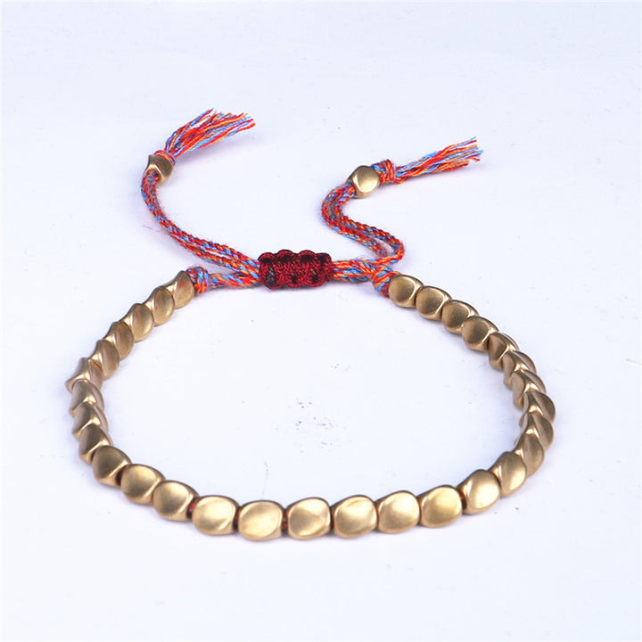 Braccialetto portafortuna con perline di rame tibetano Buddha Stones