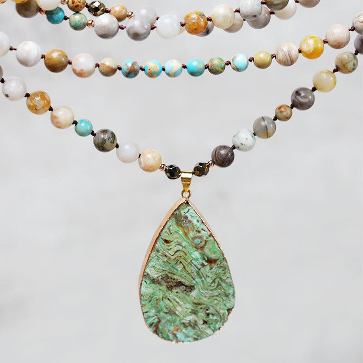 Collana di perline di guarigione in diaspro Picasso naturale dell'oceano Buddha Stones
