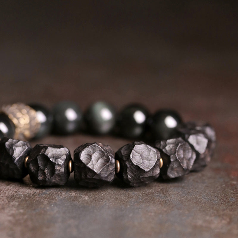 Braccialetto di coppia forza in rame, legno di ebano e ossidiana nera Buddha Stones