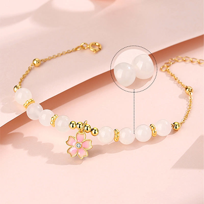 Braccialetto di protezione in giada bianca Hetian con fiori di ciliegio in argento sterling 925 Buddha Stones