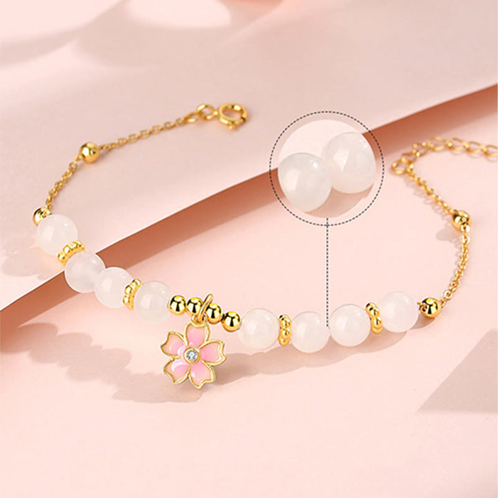 Braccialetto di protezione in giada bianca Hetian con fiori di ciliegio in argento sterling 925 Buddha Stones