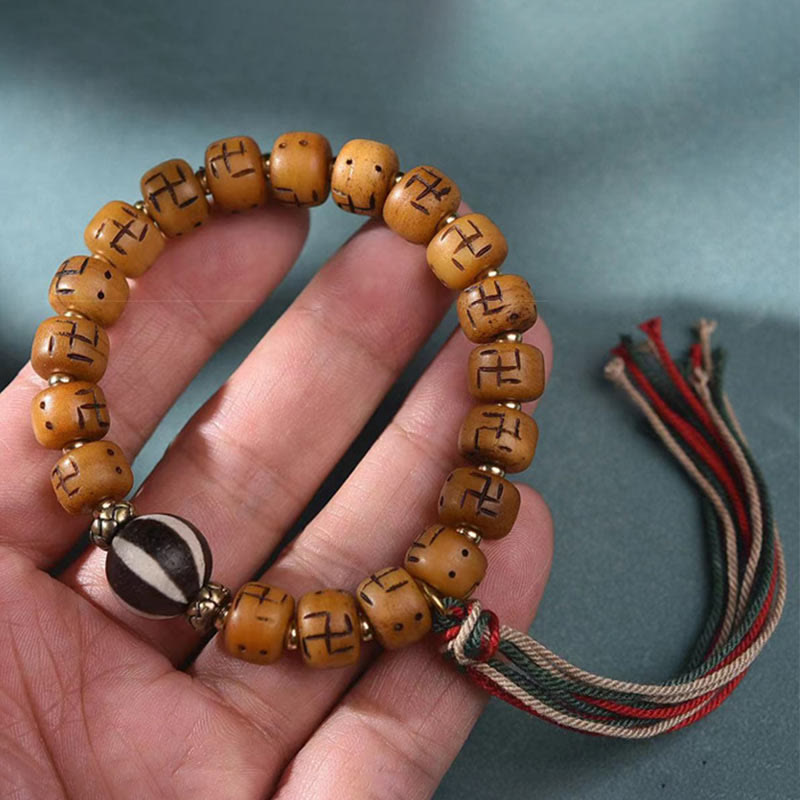 Buddha Stones naturale tibetano osso di cammello svastica Dzi perlina Shankha Buddha fascino Kirtimukha braccialetto con nappa protezione fortuna