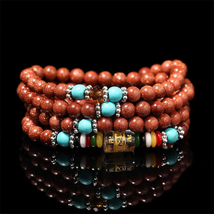 Buddha Stones 108 Mala Beads Goldstone Om Mani Padme Hum Swastika Braccialetto di Fiducia