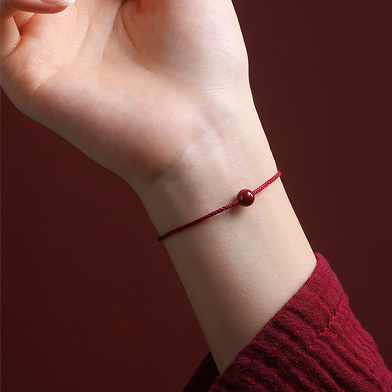 Braccialetto di corda rossa con benedizione in agata rossa naturale e cinabro Buddha Stones