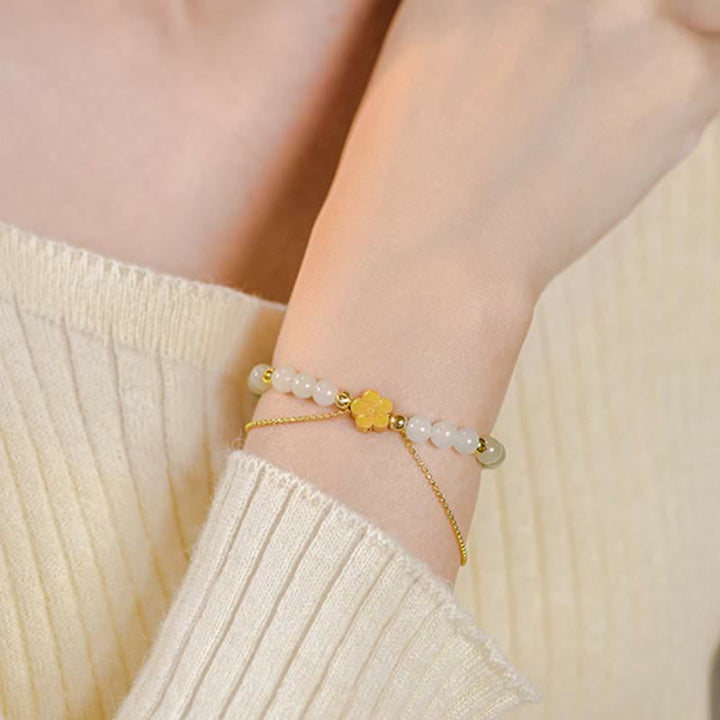 Bracciale Buddha Stones in argento sterling 925 con giada naturale Hetian e fiori di pesco