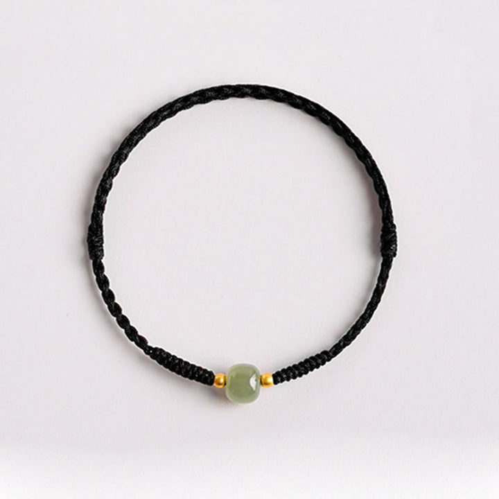 Bracciale intrecciato con Buddha Stones e portafortuna