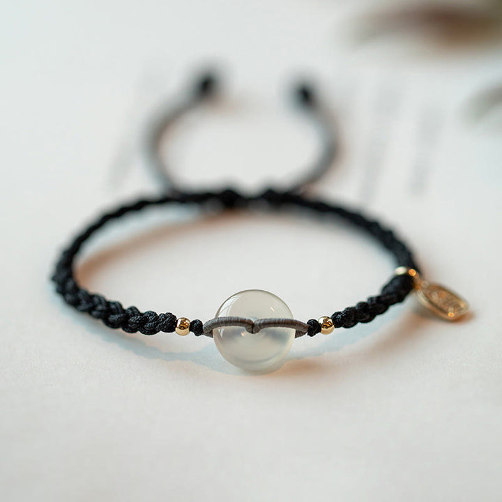 Braccialetto con corda positiva con fibbia rotonda in calcedonio Buddha Stones