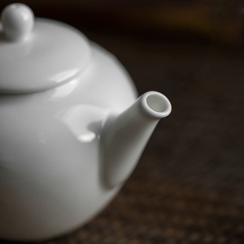 Teiera in ceramica con motivo inciso in bambù e pino prugna bianca