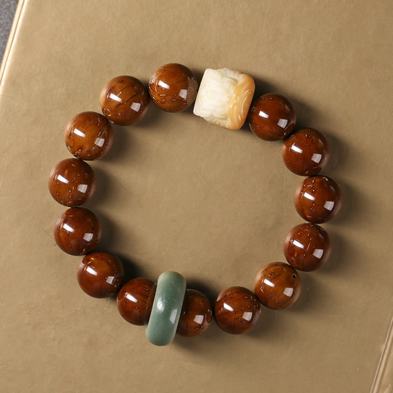 Braccialetto della saggezza del leone danzante dei semi di Bodhi viola Buddha Stones