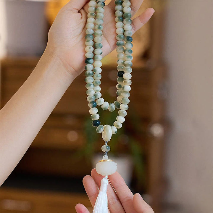 Buddha Stones naturali 108 perle Mala Bodhi Seed Lotus inciso braccialetto di saggezza nappa