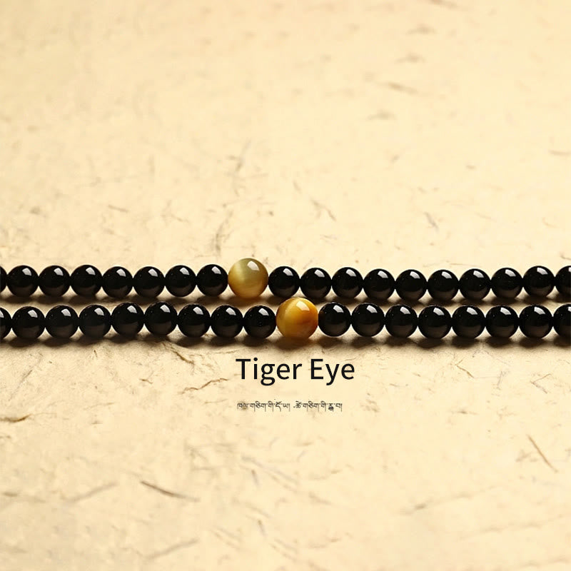 Buddha Stones Tibetano 108 Mala Beads Onice Nero Tre Occhi Dzi Beads Bracciale di Protezione