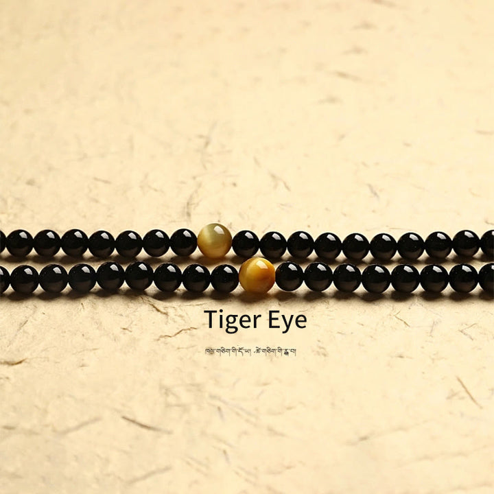 Buddha Stones Tibetano 108 Mala Beads Onice Nero Tre Occhi Dzi Beads Bracciale di Protezione