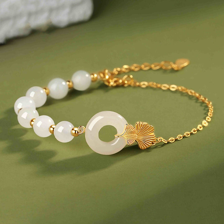Braccialetto della fortuna con foglia di ginkgo e fibbia della pace in argento sterling 925 con Buddha Stones e giada bianca Hetian
