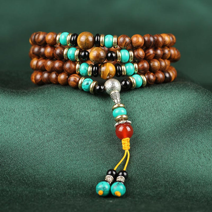 Braccialetto di guarigione Mala con 108 perle di occhio di tigre e legno di palissandro Buddha Stones