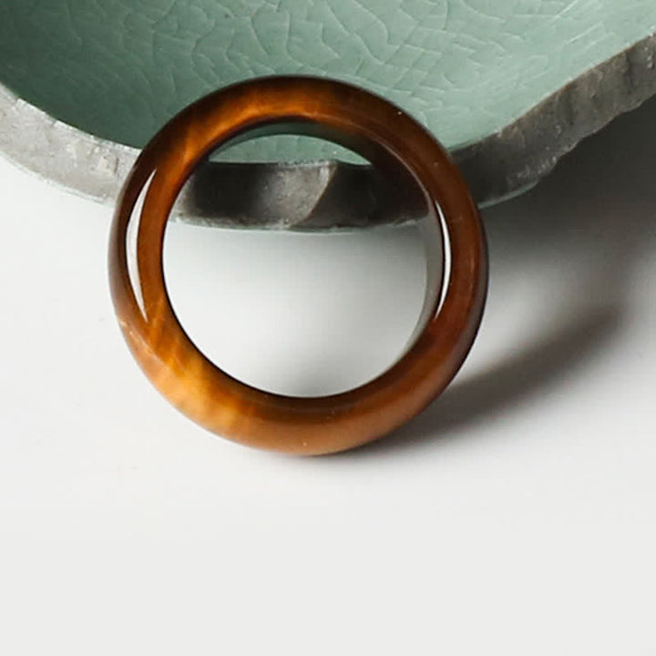 Anello di protezione della forza della pietra dell'occhio di tigre Buddha Stones