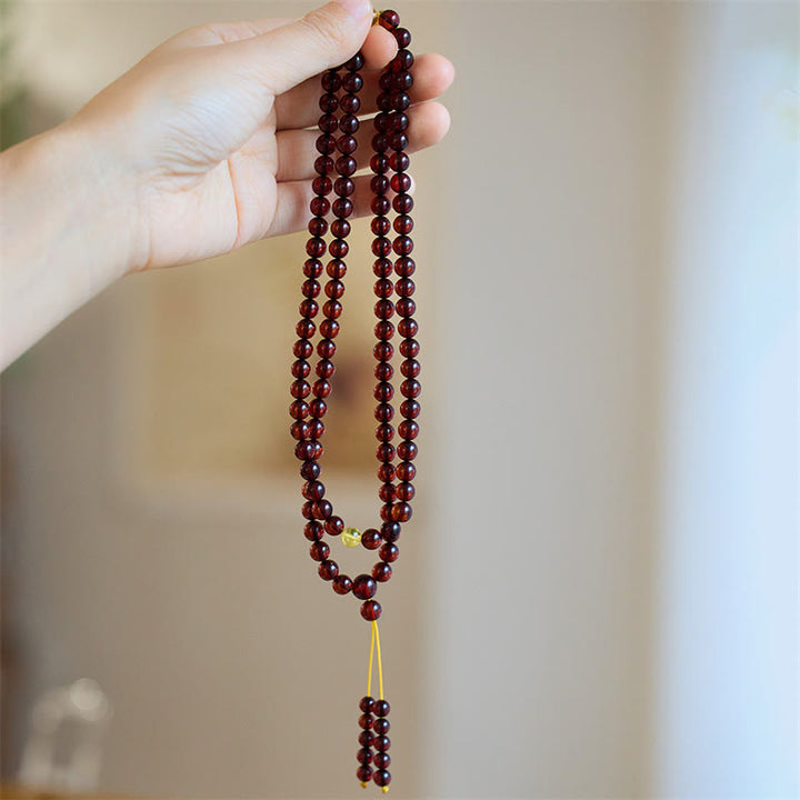 Braccialetto anti-ansia in ambra trasparente con 108 perle di Mala naturali Buddha Stones