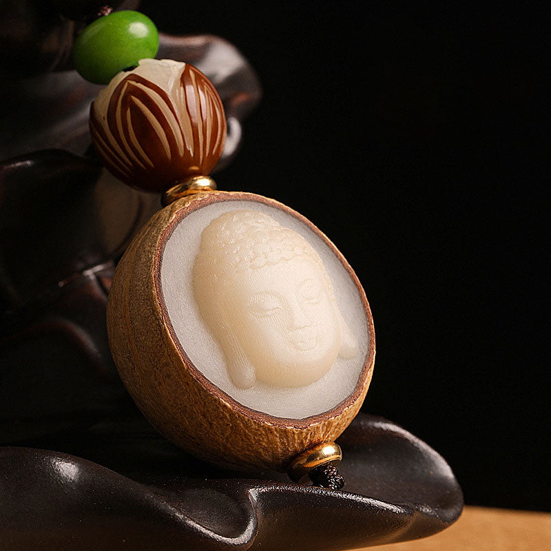 Portachiavi con decorazione Buddha Stones semi di Bodhi