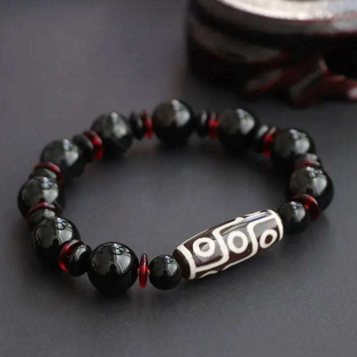Braccialetto di protezione della ricchezza con perline Dzi a nove occhi in onice nero Buddha Stones