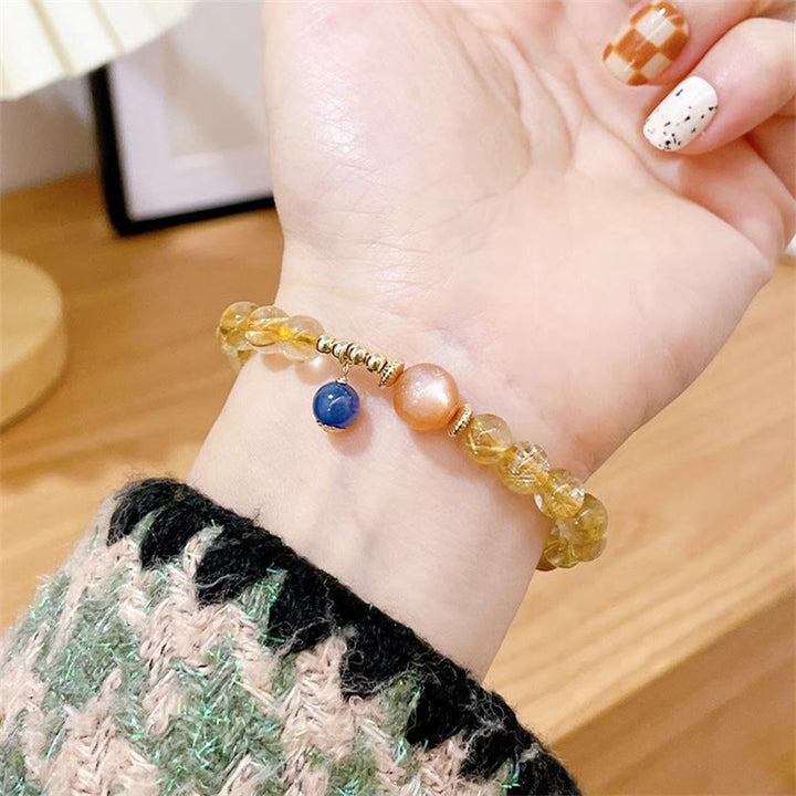 Bracciale Buddha Stones in oro naturale, quarzo rutilato, pietra del sole, cianite, ricchezza