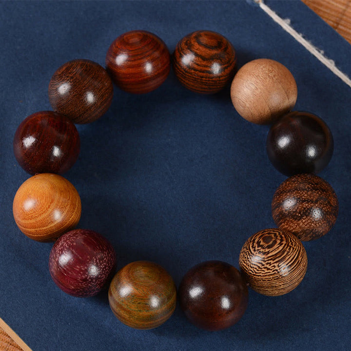 Braccialetto di guarigione di protezione multicolore in legno di sandalo Buddha Stones
